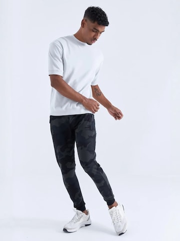 Tommy Life - Skinny Calças de desporto 'Jogginghose' em cinzento