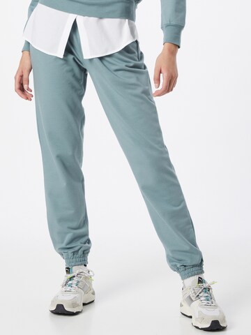 ABOUT YOU Tapered Pants 'Naomi Sweat Pants' in Green: front