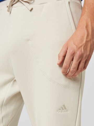 ADIDAS SPORTSWEAR Loosefit Sportbroek 'Studio Lounge Fleece' in Beige