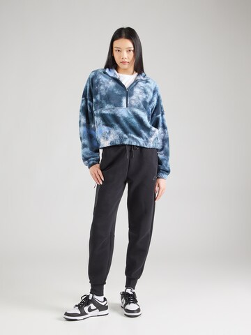 Nike Sportswear Tapered Trousers in Black