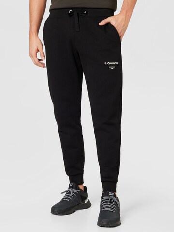 BJÖRN BORG Tapered Sports trousers in Black: front