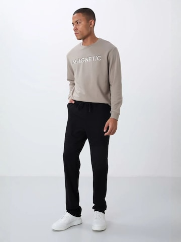 Tommy Life Sports trousers 'Jogginghose' in Black: front
