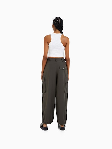 Bershka Tapered Pleat-Front Pants in Green