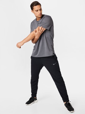 NIKE Regular Sports trousers in Black