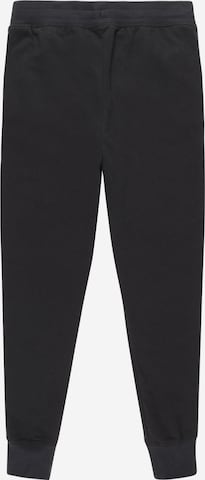 UNDER ARMOUR Tapered Sporthose in Schwarz