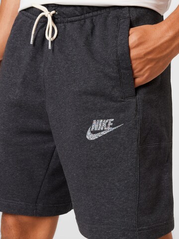 Nike Sportswear Szabványos Nadrág 'REVIVAL' - fekete