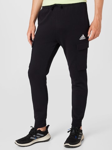 ADIDAS SPORTSWEAR - Tapered Calças de desporto 'Essentials Fleece' em preto: frente