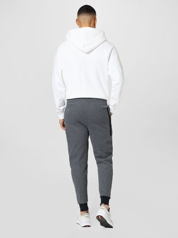 Tapered Pantaloni de la Nike Sportswear pe negru