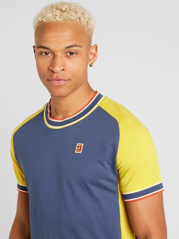 NIKE - Camiseta funcional 'HERITAGE' en azul