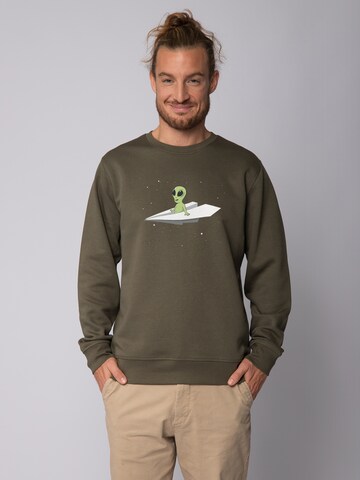 Watapparel Sweatshirt ' Alien on a paper plane ' in Grün: Vorderseite