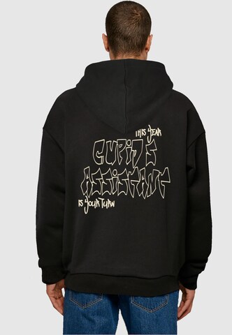 Merchcode Sweatshirt 'Cupid´s Assistant' in Zwart