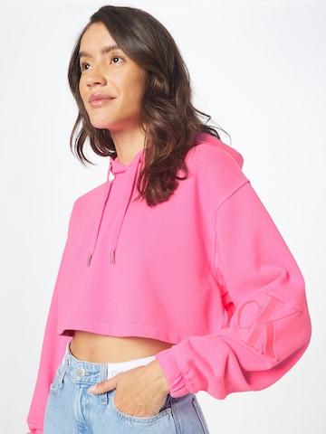 Calvin Klein JeansSweater majica - roza boja: prednji dio