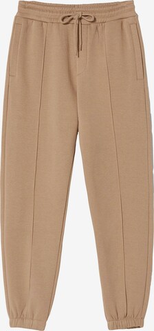 Bershka Tapered Trousers in Beige: front