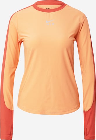 T-shirt fonctionnel NIKE en orange : devant