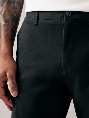 Loosefit Pantaloni chino di Next in nero
