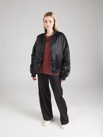 Maglietta di Champion Authentic Athletic Apparel in marrone