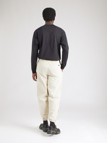 Effilé Pantalon 'CLUB' Nike Sportswear en vert