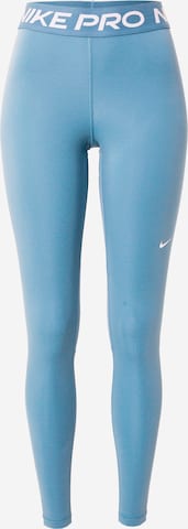 NIKE Skinny Workout Pants in Blue: front