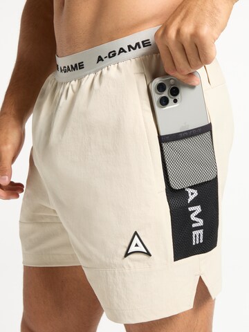 regular Pantaloni sportivi di A-Game in beige