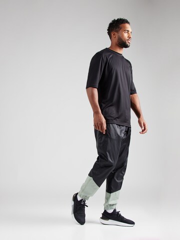 Effilé Pantalon Nike Sportswear en noir