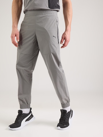 pelēks PUMA Pakapēniski sašaurināts piegriezums Sporta bikses 'PUMATECH': no priekšpuses