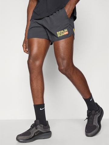 NIKE Ohlapna forma Športne hlače 'CITY MRTH STRIDE' | črna barva
