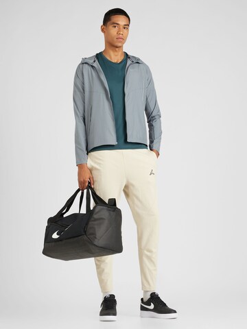 Jordan Slimfit Spodnie sportowe 'Essential' w kolorze beżowy