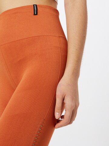 Superdry Skinny Spodnie sportowe 'Flex' w kolorze pomarańczowy