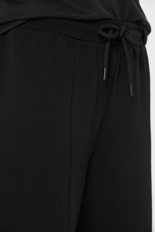SENSES.THE LABEL Regular Weite Hose aus Interlock-Jersey in Schwarz