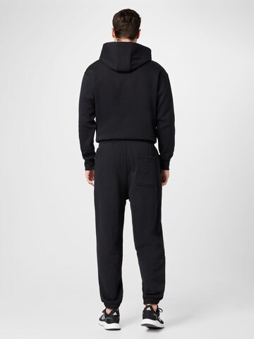 ADIDAS SPORTSWEAR Дънки Tapered Leg Спортен панталон 'Lounge Heavy French Terry' в черно