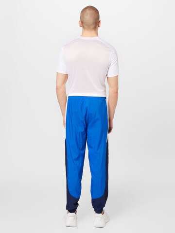 Reebok Zwężany krój Spodnie sportowe w kolorze niebieski