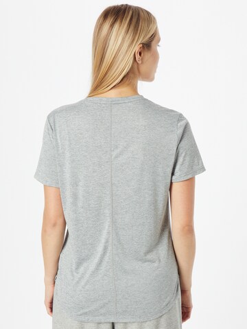 NIKE - Camiseta funcional en gris