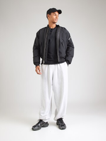 Nike Sportswear T-Shirt 'SSNL CLUB' in Schwarz