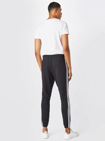 ADIDAS SPORTSWEAR Tapered Hose 'Essentials French Terry Tapered 3-Stripes' in Schwarz