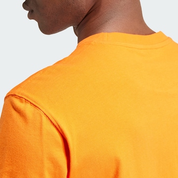 ADIDAS ORIGINALS - Camiseta 'Adicolor Trefoil' en naranja