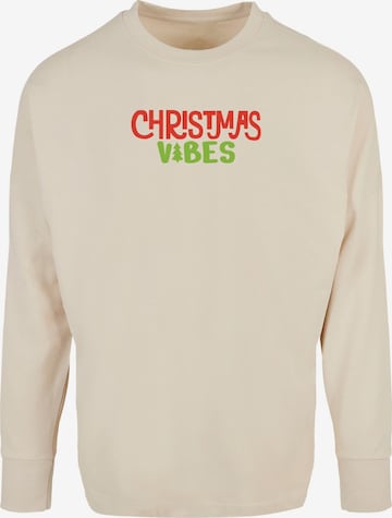 T-Shirt 'Christmas Vibes' Merchcode en beige : devant
