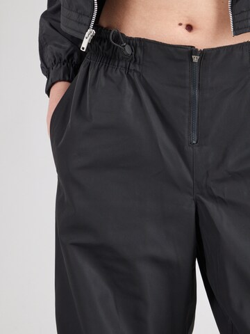 Nike Sportswear Wide leg Trousers 'Repel' in Black