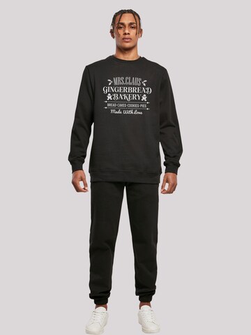Sweat-shirt 'Santas Gingerbread Bakery Retro Christmas' F4NT4STIC en noir