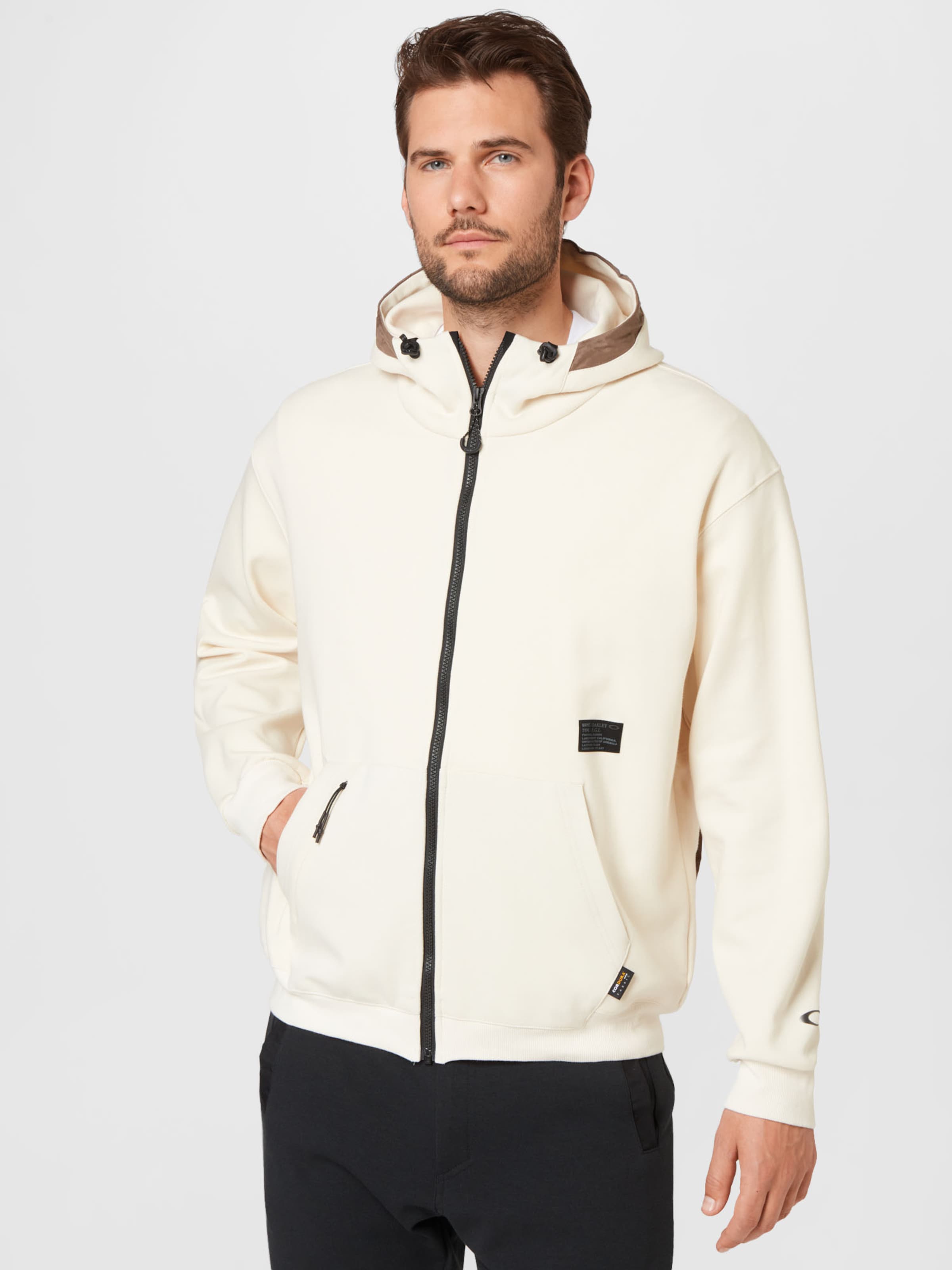Männer Sportbekleidung OAKLEY Sportsweatjacke in Hellbeige - XV04681 Männer Sportbekleidung OAKLEY Sportsweatjacke in Hellbeige - XV04681