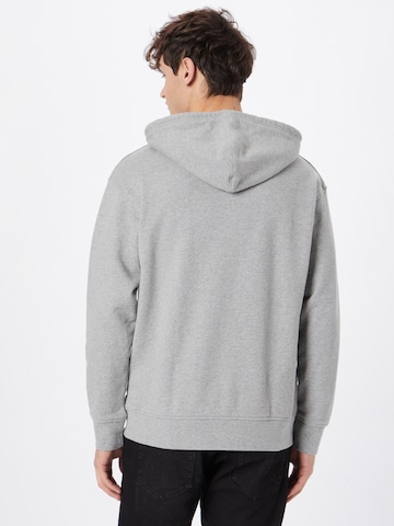 LEVI'S ®Regular Fit Sweater majica 'Relaxed Graphic Hoodie' - siva boja