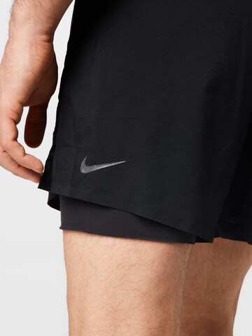 NIKE Regular Workout Pants in Black