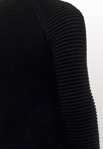 Rusty Neal Sweater in Black