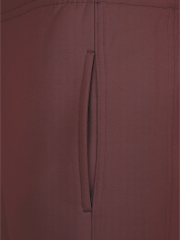 Tapered Pantaloni di Urban Classics in rosso