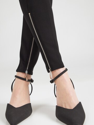 ABOUT YOU Skinny Leggingsit 'Miles' värissä musta