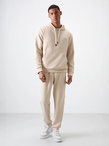 Tommy Life Tracksuit in Beige: front