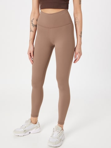 Athlecia Skinny Workout Pants 'GABY' in Brown: front
