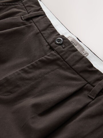 Next Lużny krój Spodnie w kolorze brązowy