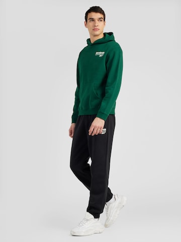 Reebok Športna majica 'PROUD' | zelena barva