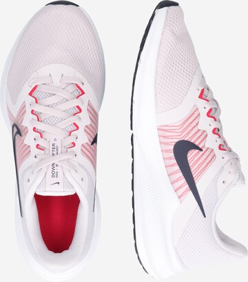 Chaussure de course 'DOWNSHIFTER 11' NIKE en rose