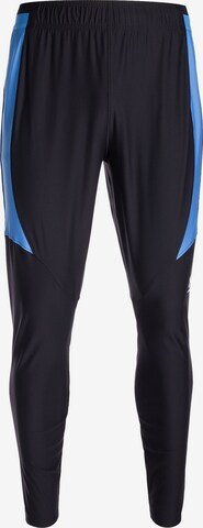 UNDER ARMOUR Workout Pants in Black: front